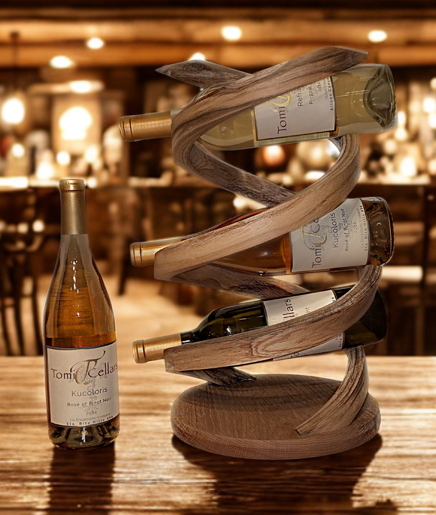 Wooden wine rack holding multiple bottles of wine on a wooden table.